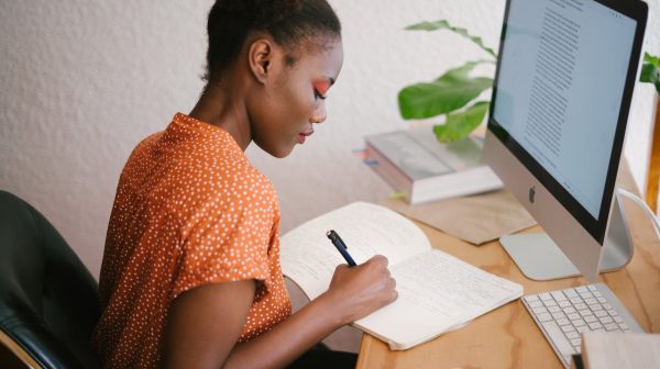 Student taking notes