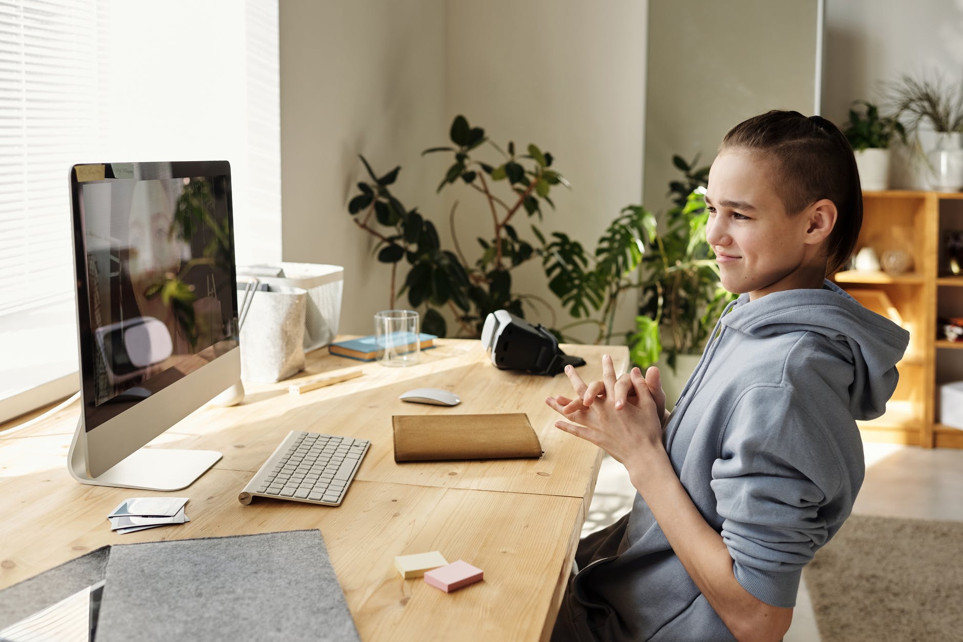 Person in front of desktop computer .