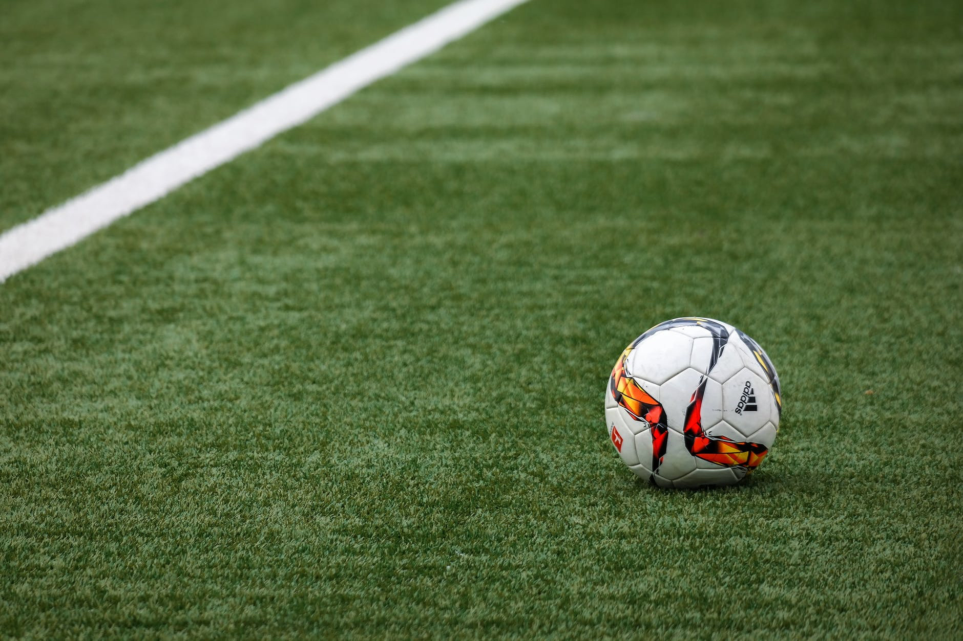 Soccer ball on grass soccer field