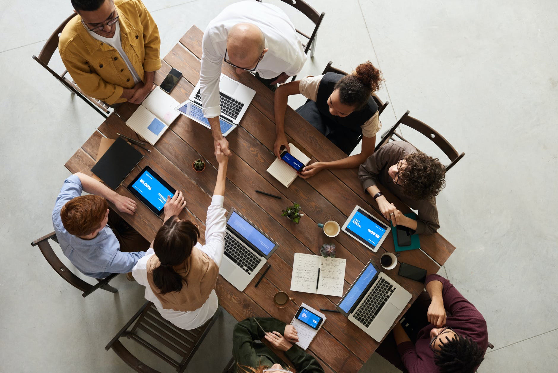 View from above of table with students working as a team.