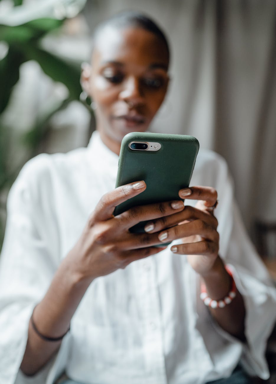 Woman using smartphone for chat.