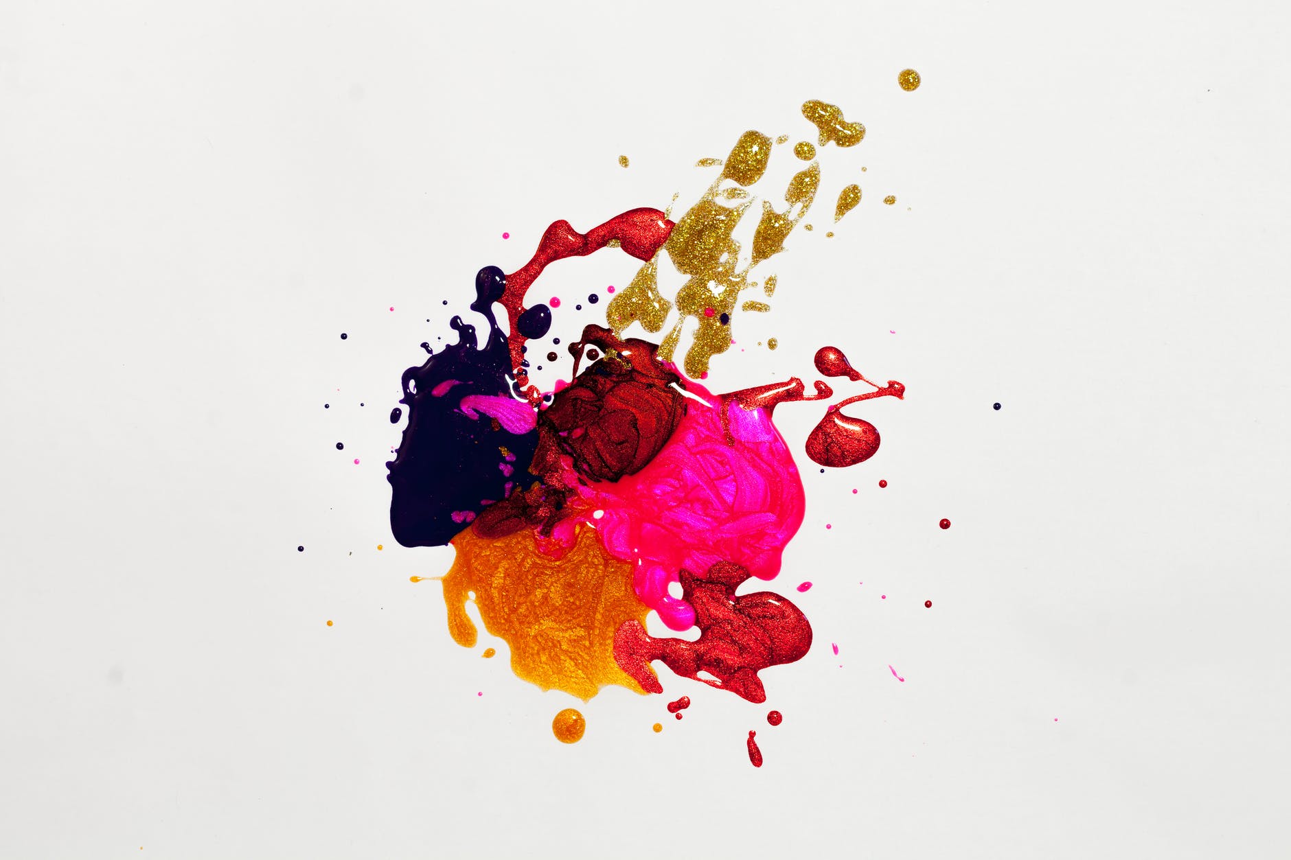 White canvas with several paints blended together. Colors include orange, red, yellow, and purple.