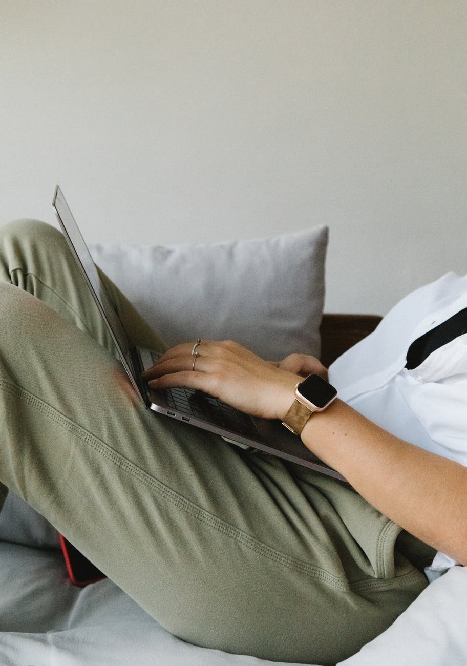 Woman on couch typing
