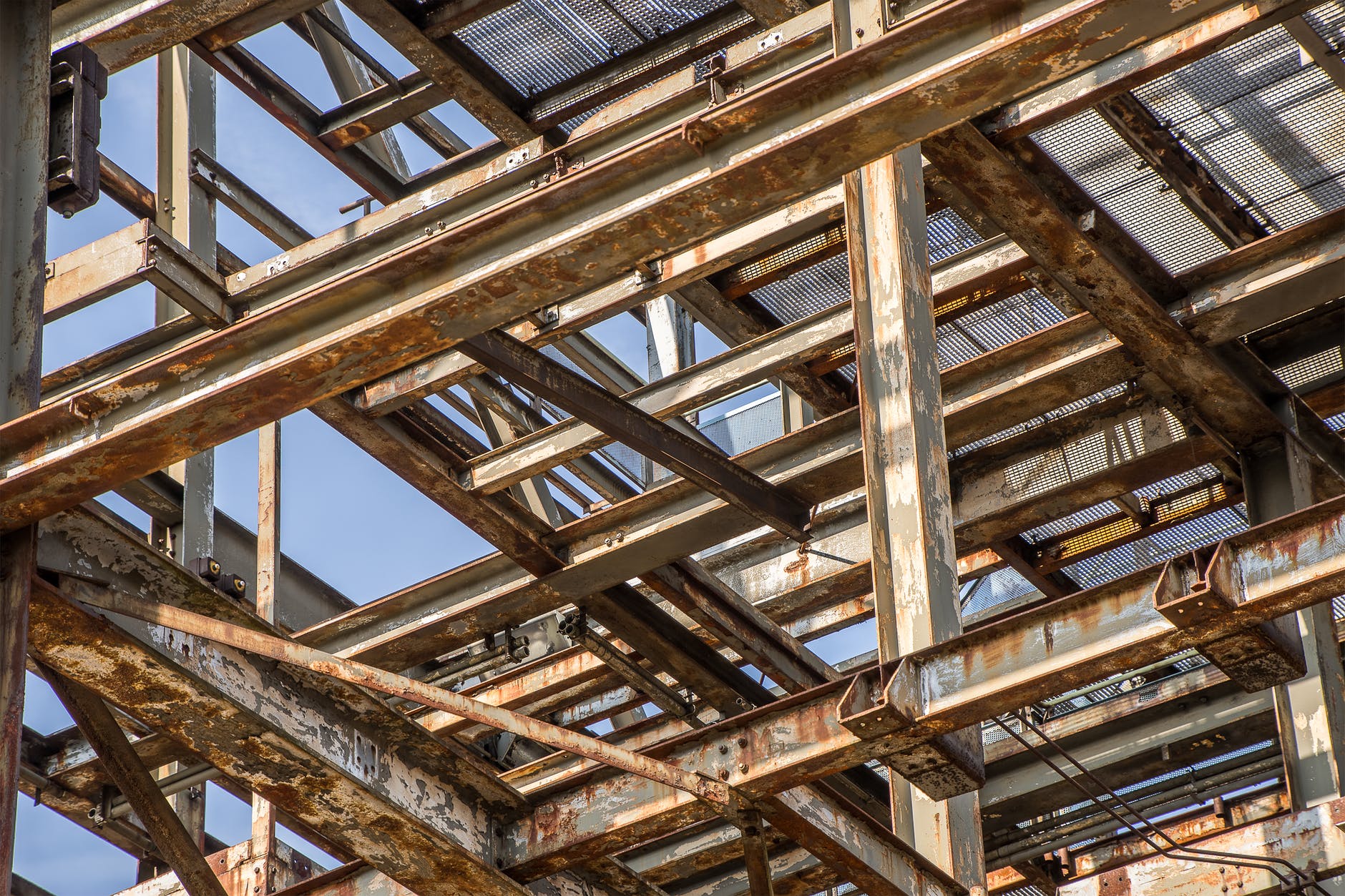 Metal framework for building with rusted metal beams.