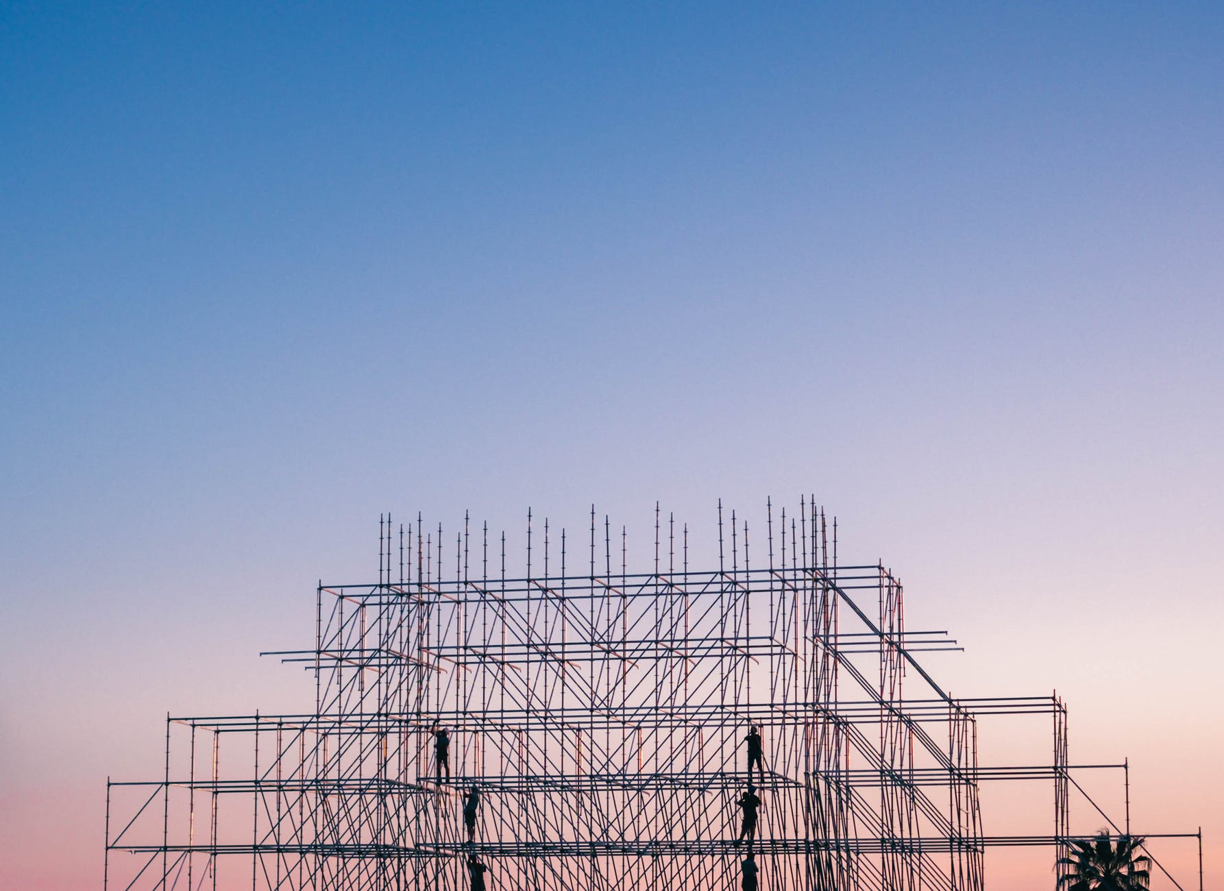 Building scaffolding and sunset.