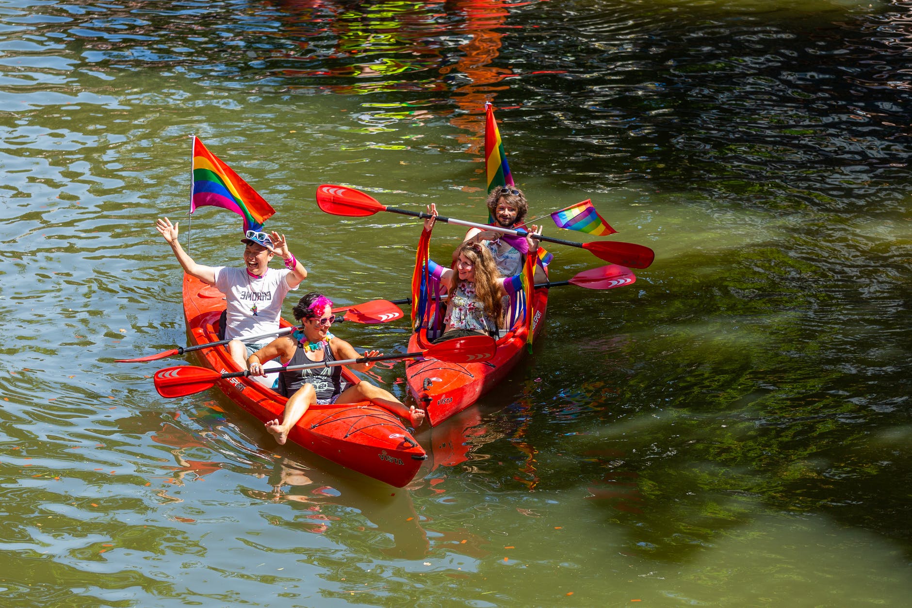 Two kayaks with people on the water.