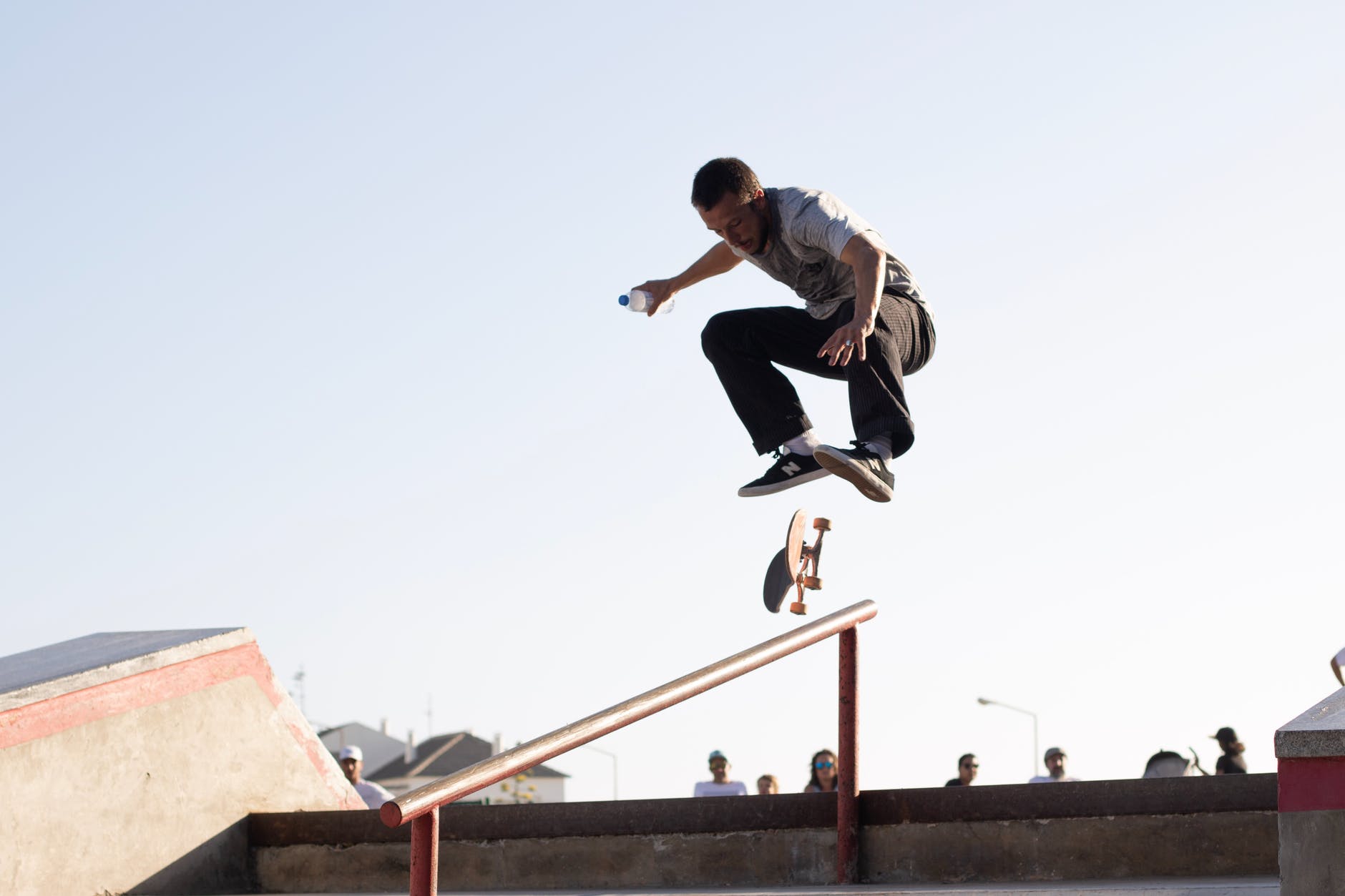 Skateboarder doing a trick on stair railing