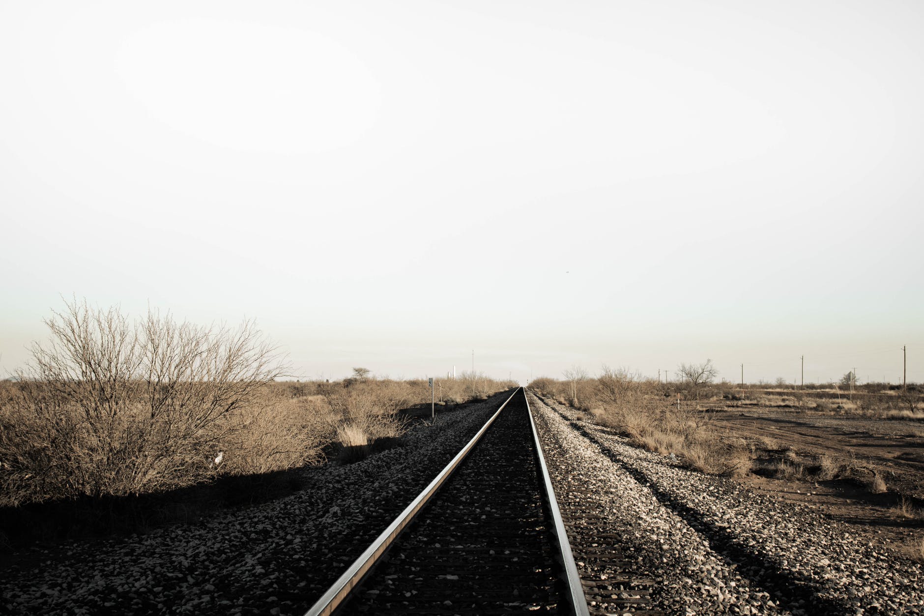 Train tracks and open land.