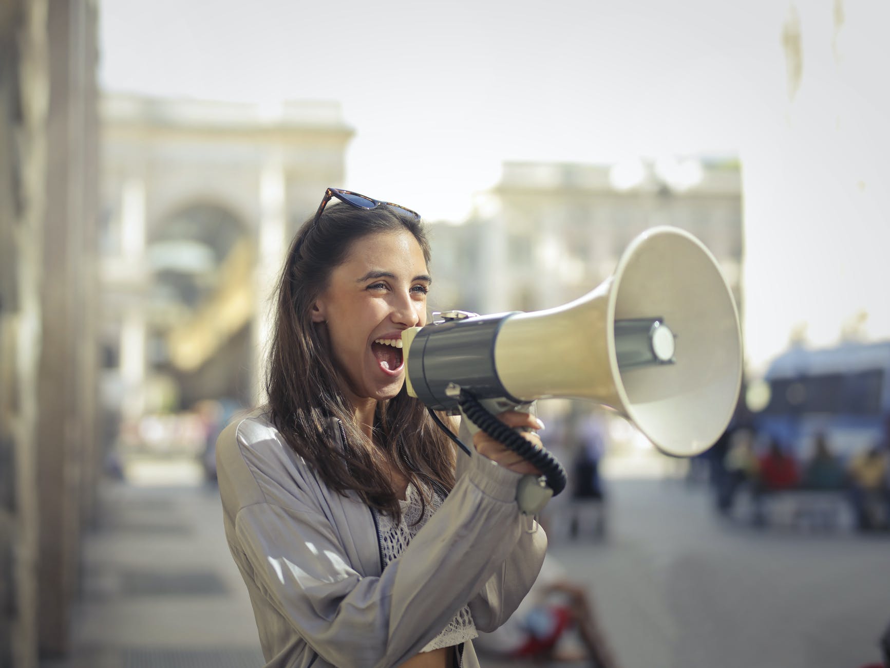 Woman with sunglasses and megaphone