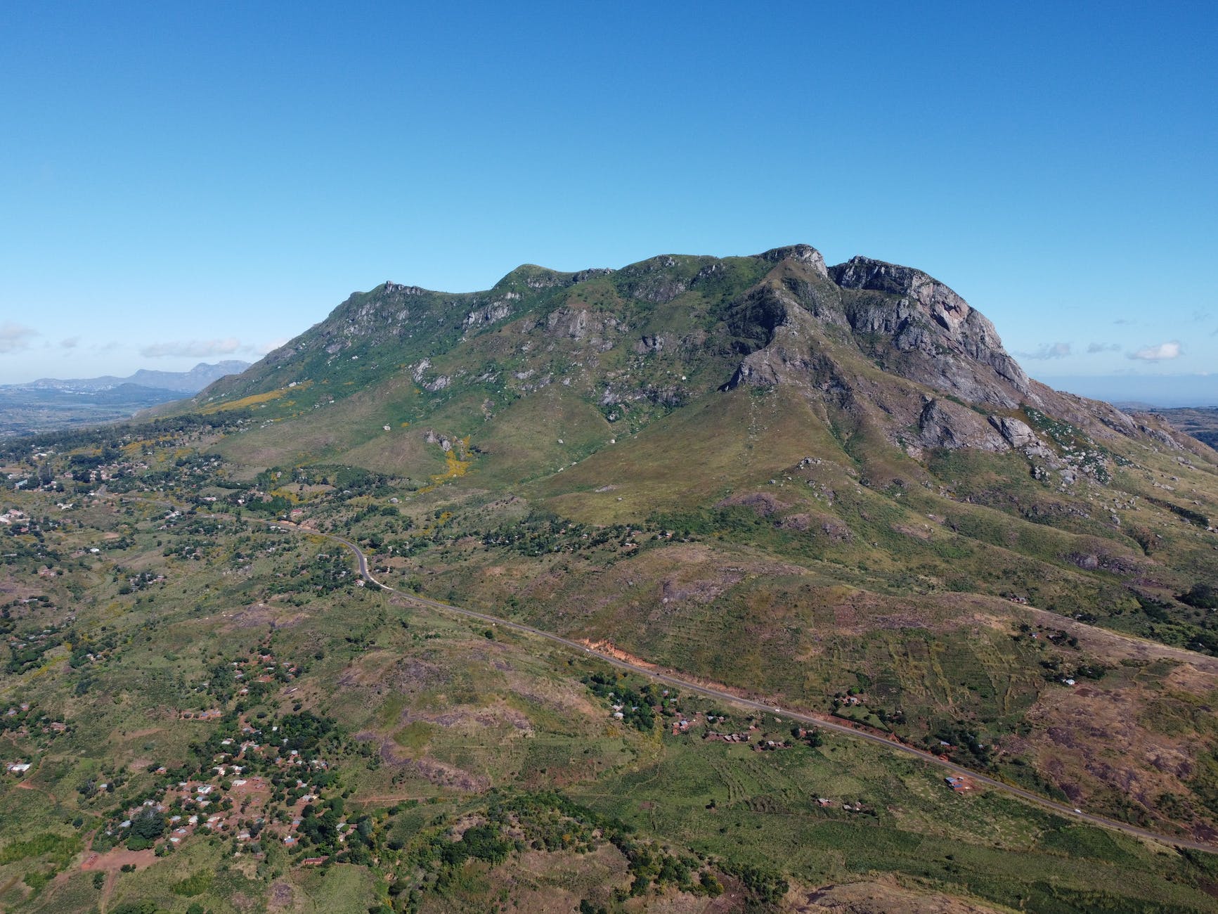 Scenic view of mountain and blue skies.