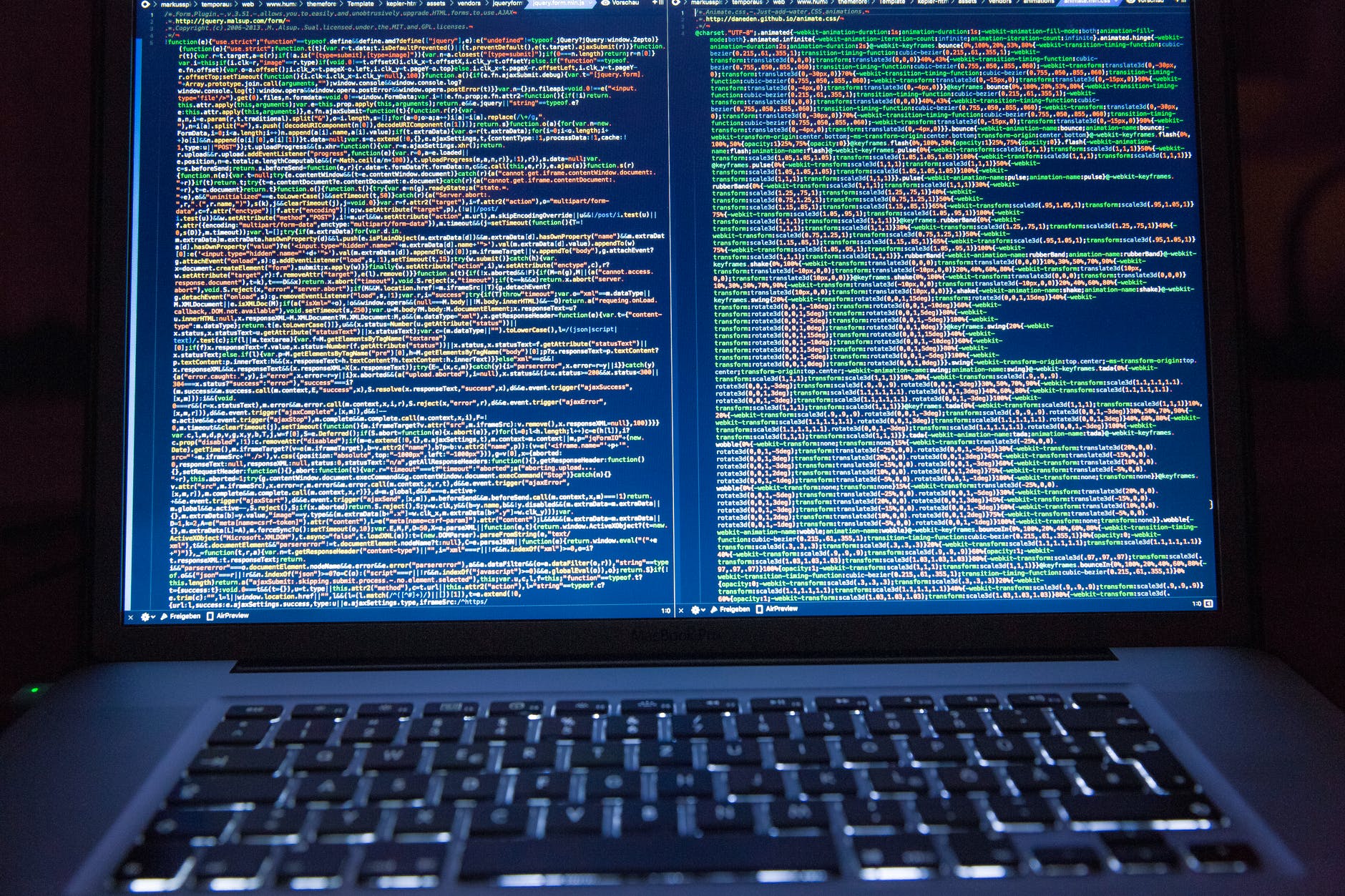 Computer with screen with code.