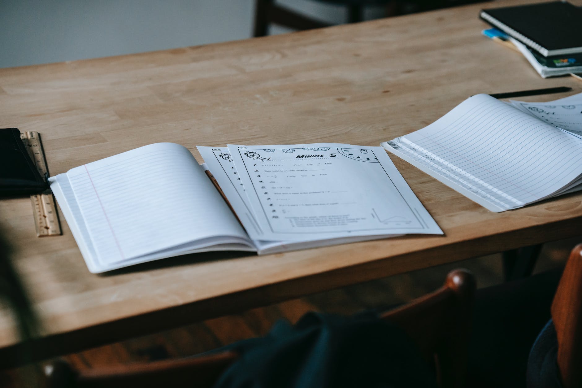 Notebook and Minute sheets on table
