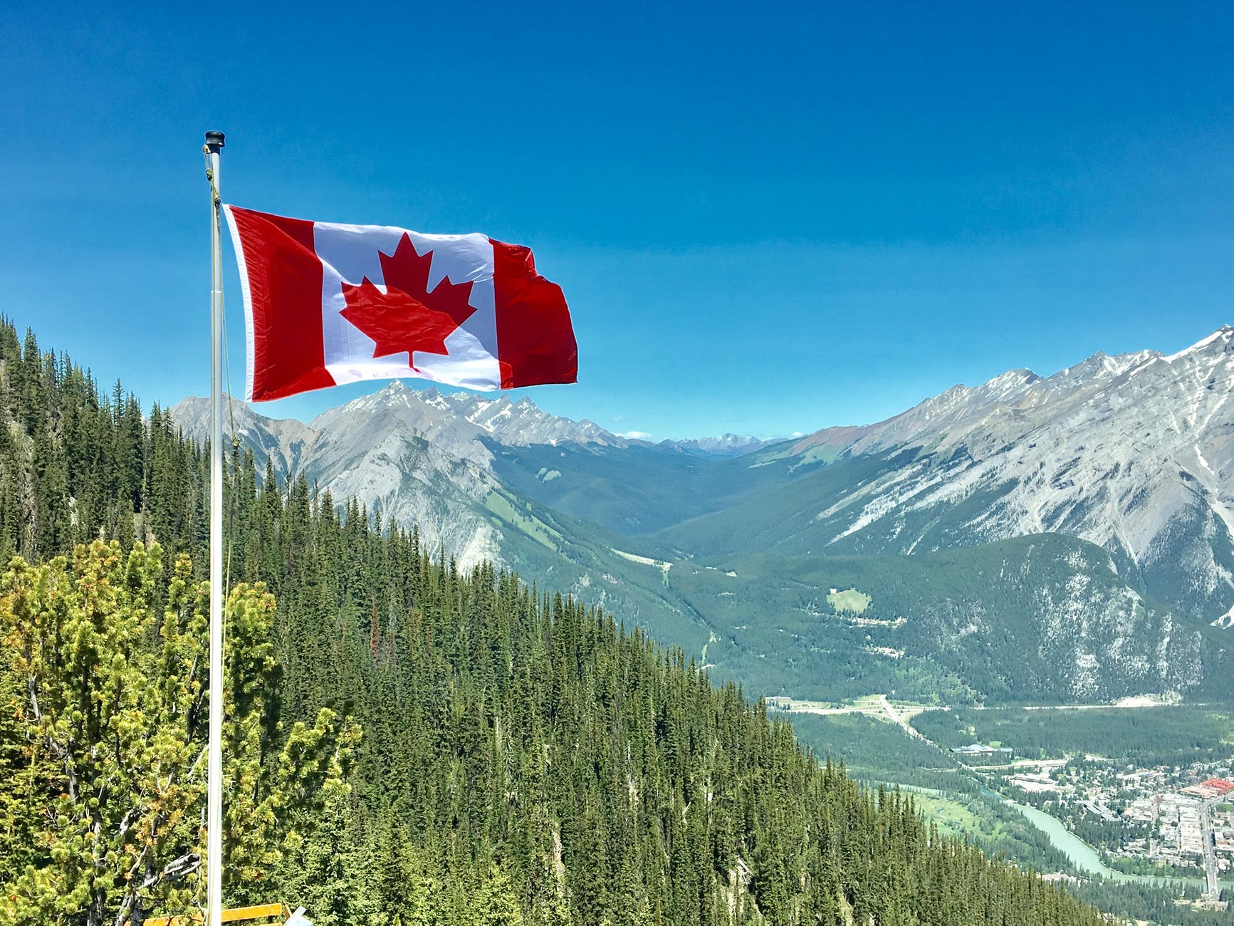 Canadian flag on hill.