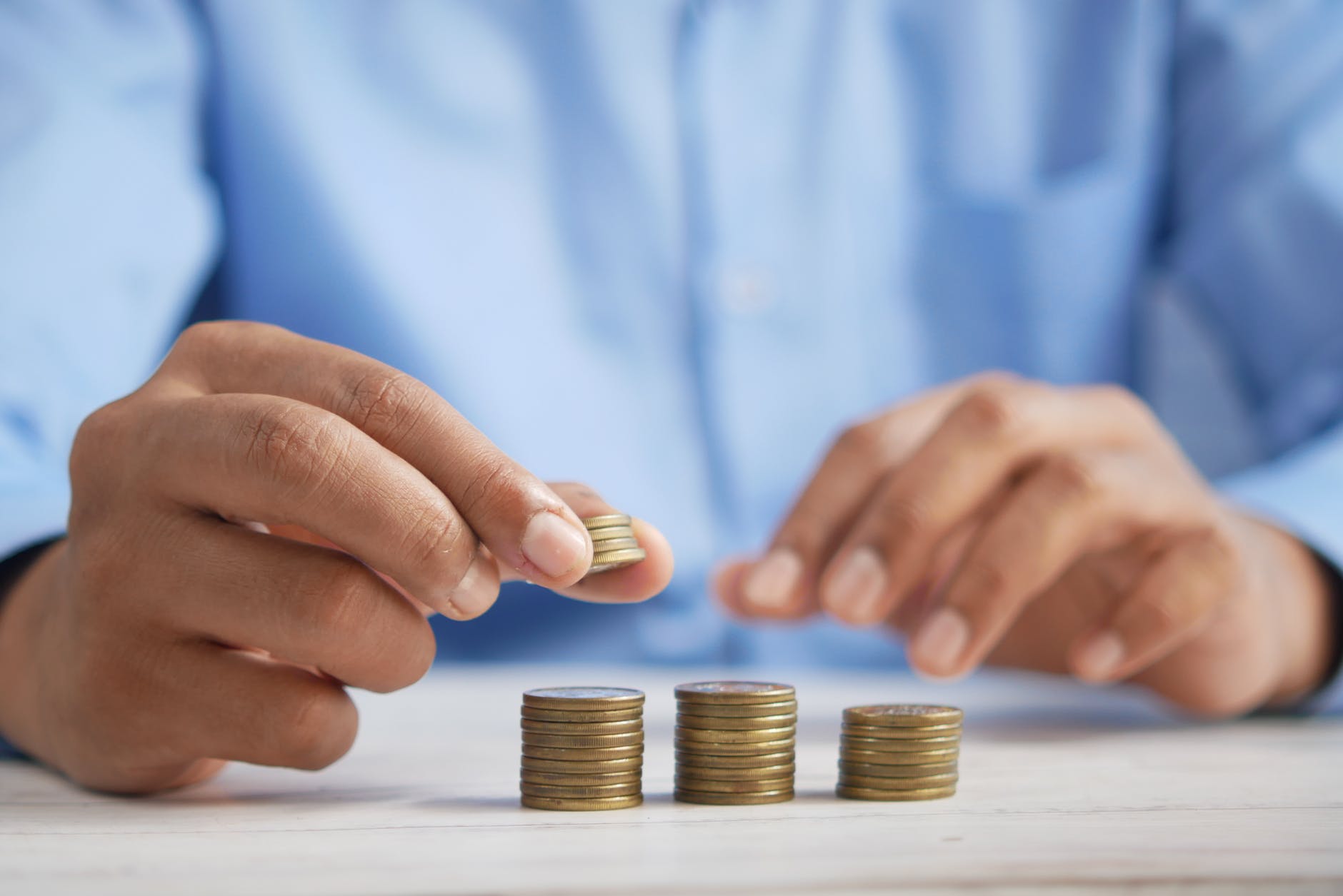 Hands stacking coins