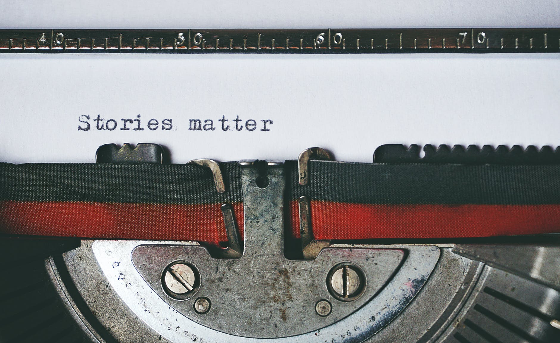 Typewriter with "Stories matter" typed on paper