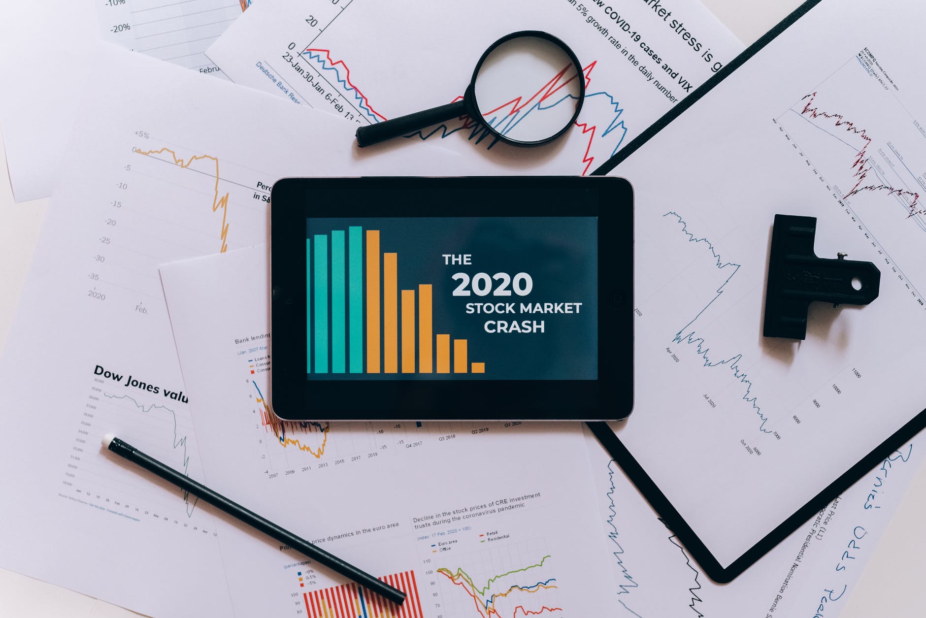 Tablet with graphs and text "The 2020 Stock Market Crash"