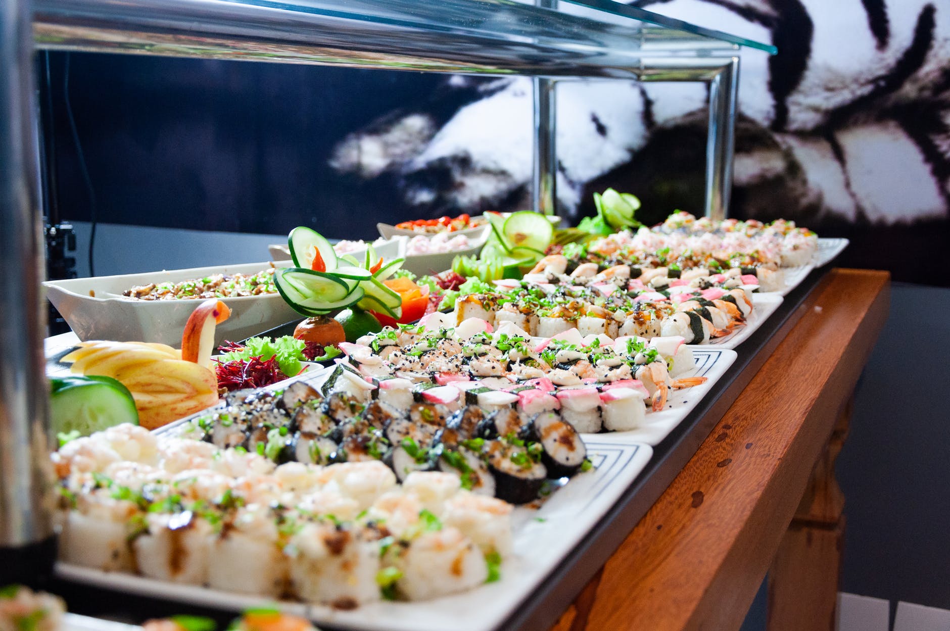 buffet table with sushi trays
