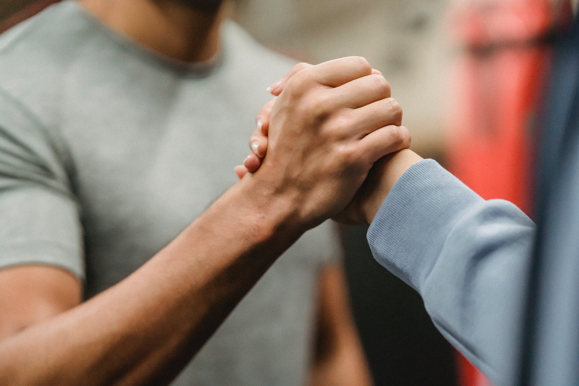 two hands from two people holding