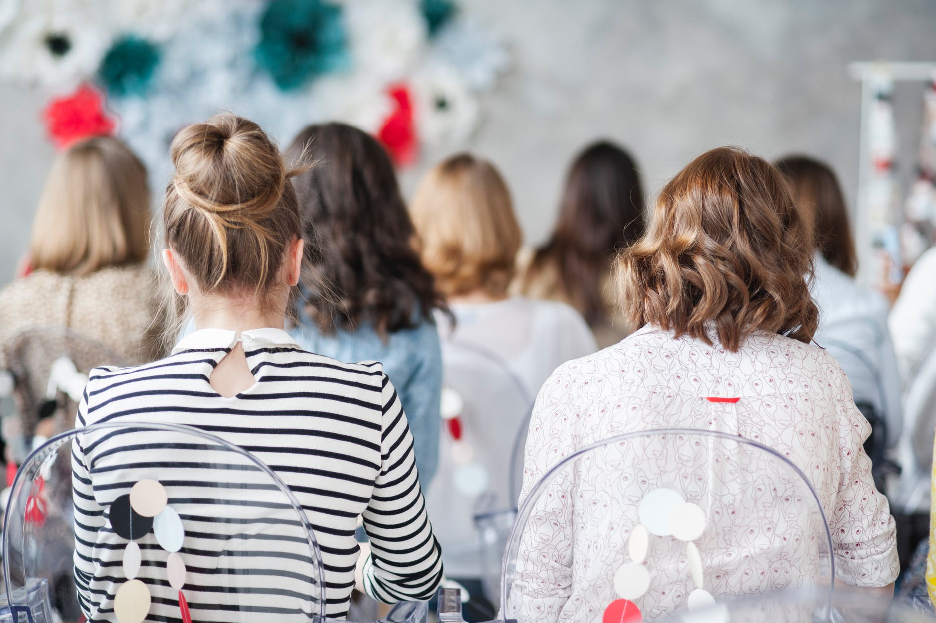 backs of students in a classroom