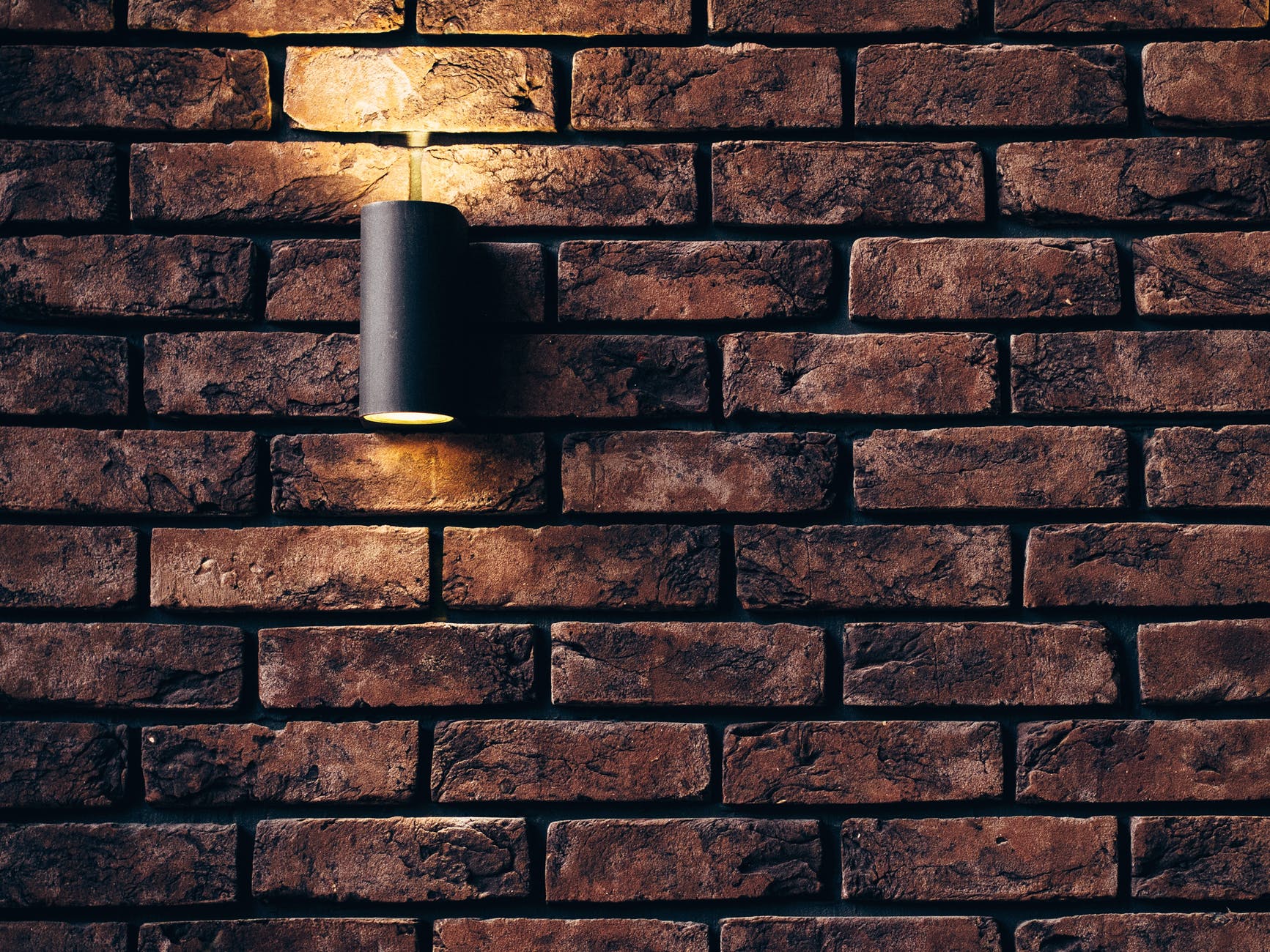 Brick wall with lamp
