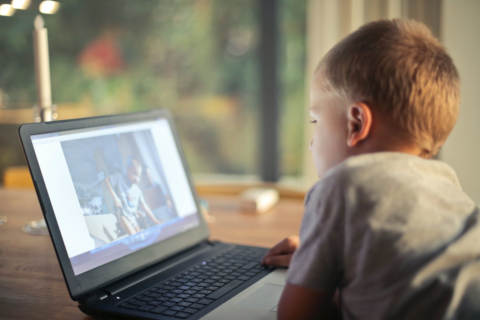 Boy in front of laptop