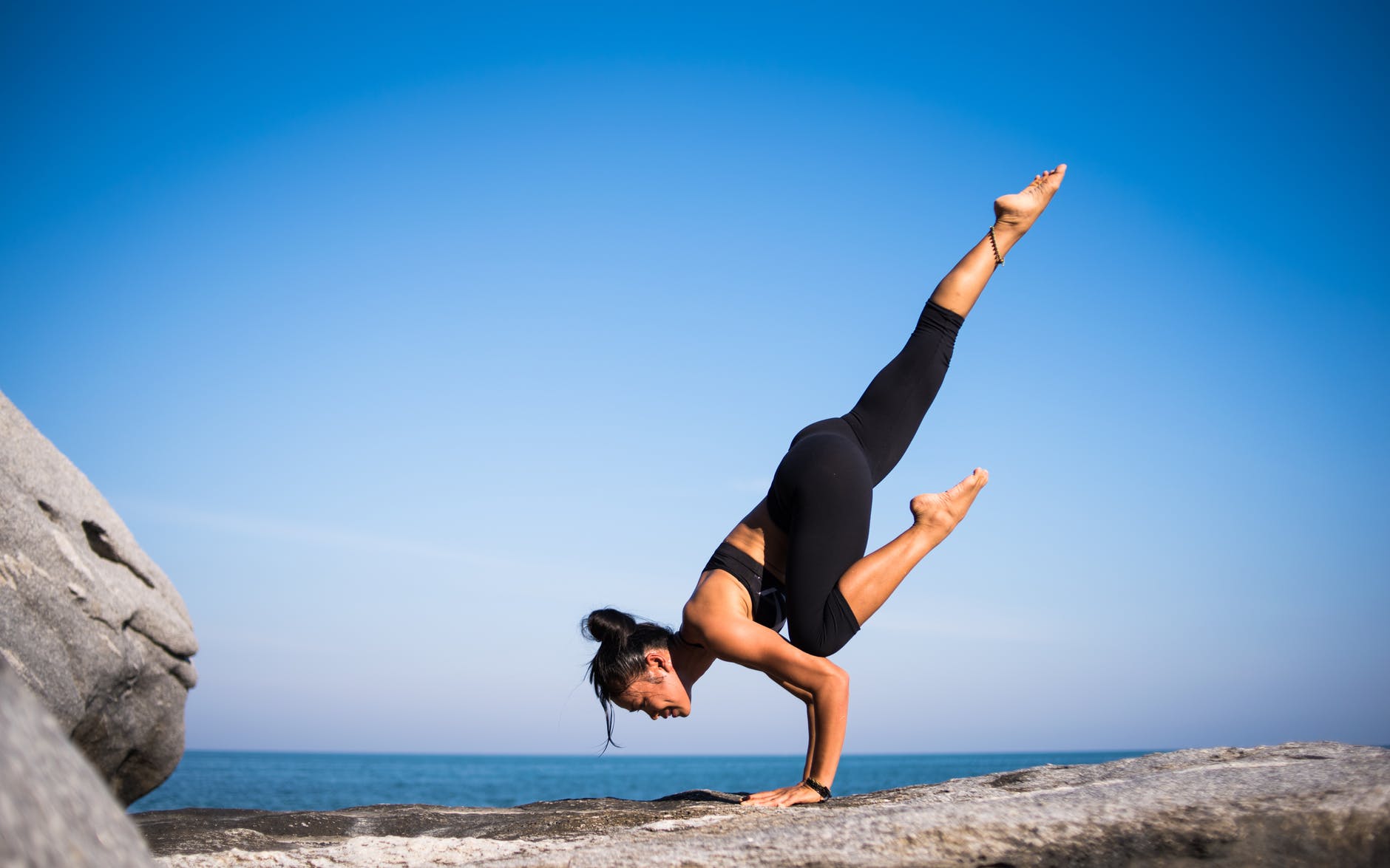woman doing handstand and yoga
blue skies
