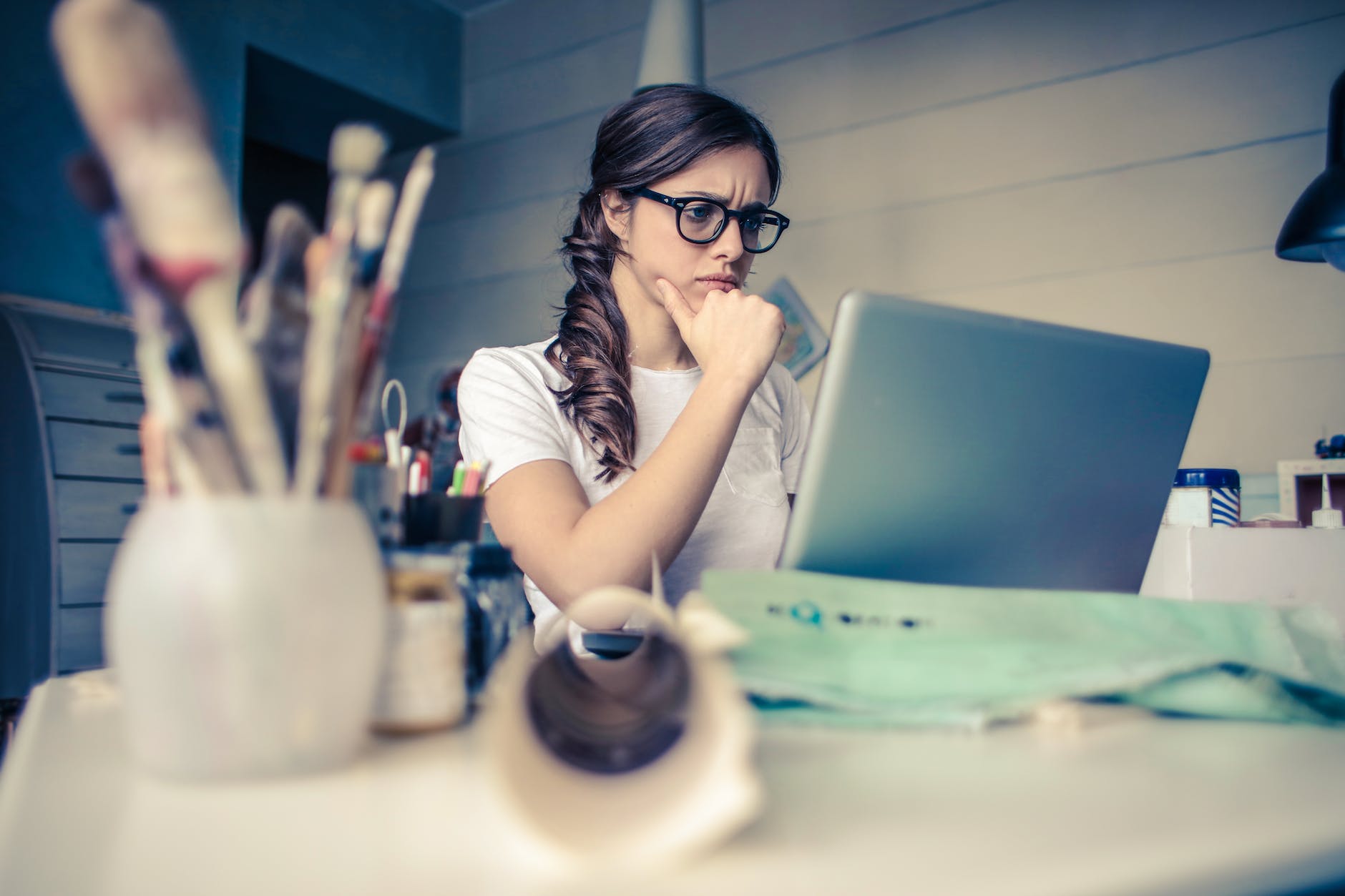 woman working on laptop looking at screen
