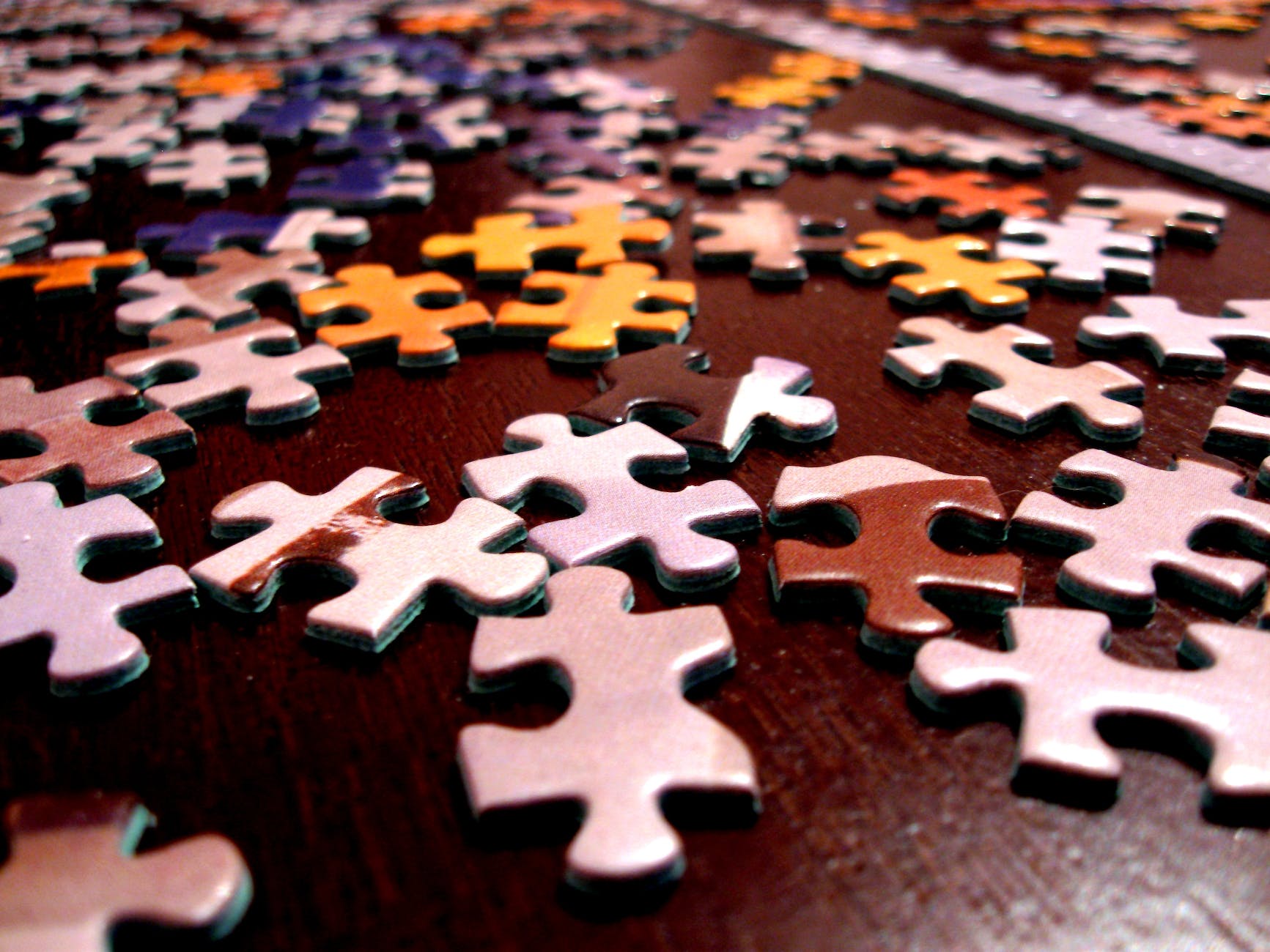 puzzle pieces on a wood table