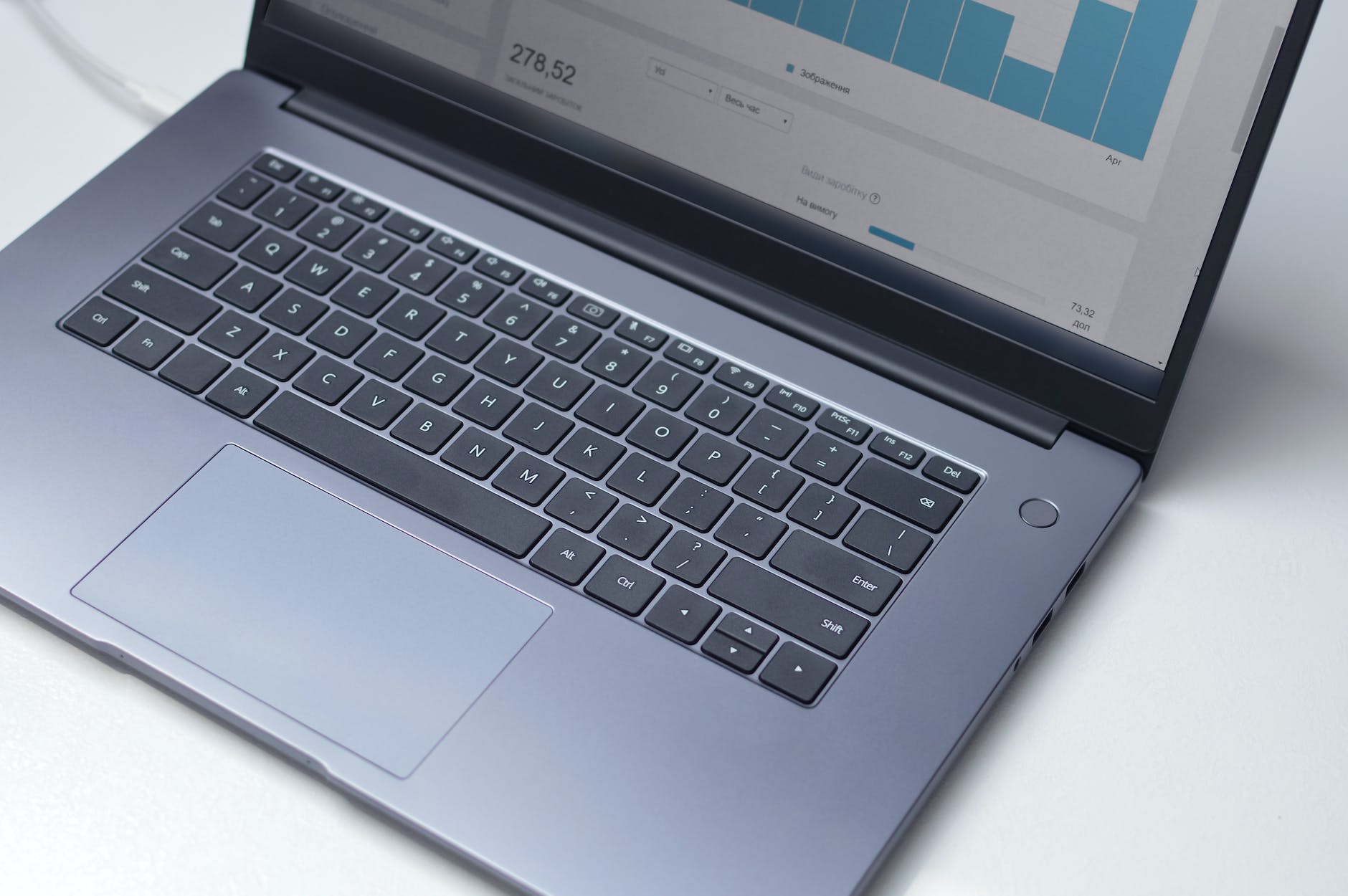 keyboard and part of a dataset on laptop screen