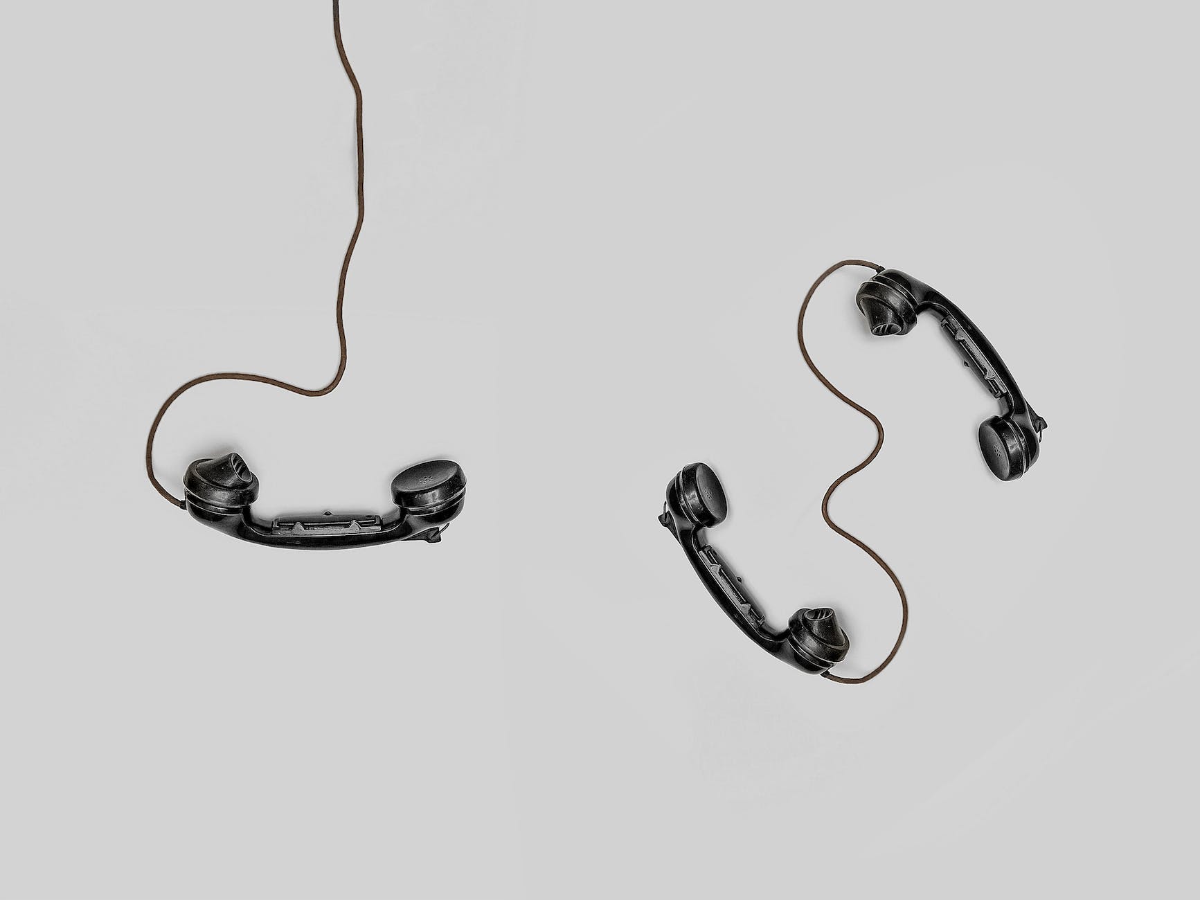 three telephone headsets