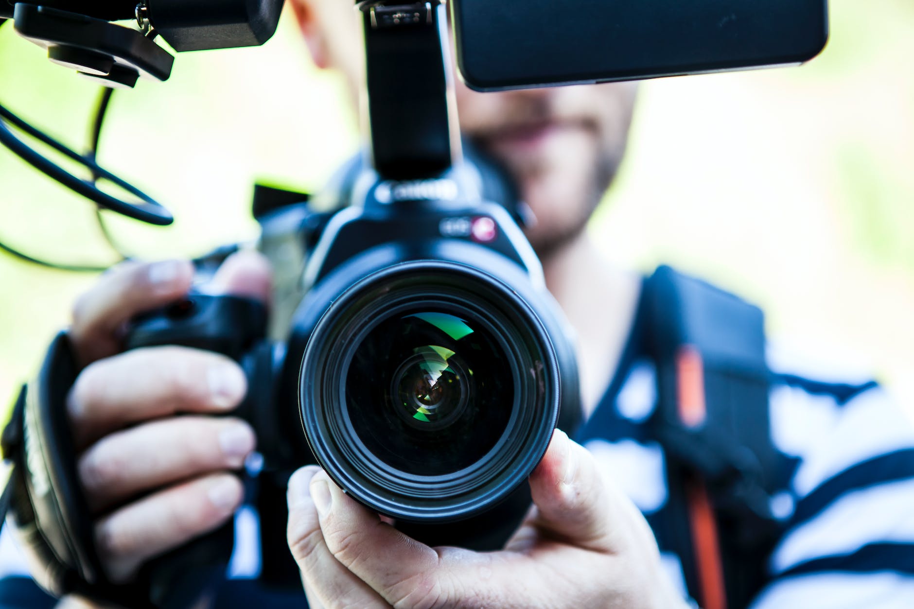 Person holding camera for close-up photo
