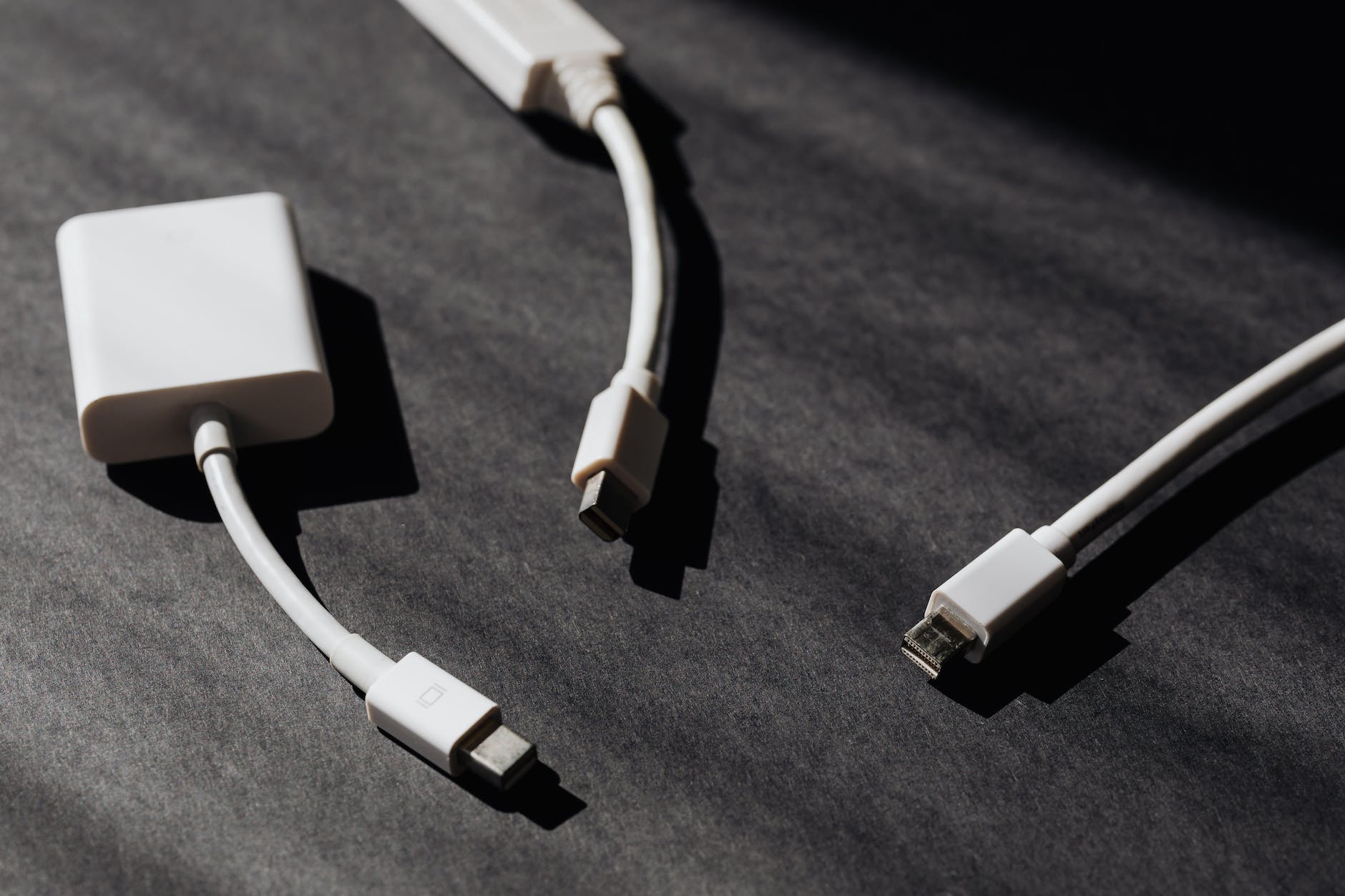 three computer cable adapters