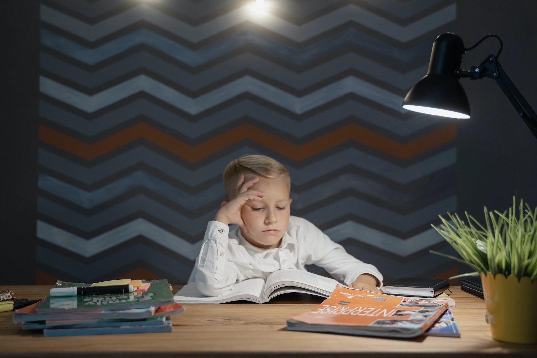 student at table with open book