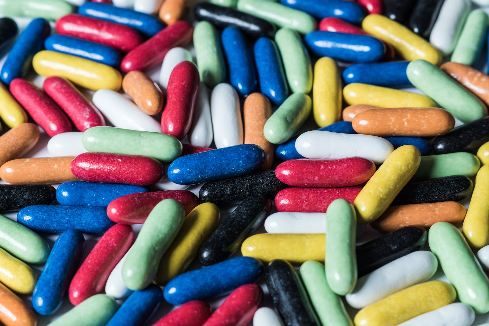 assorted plastic capsules in different colors