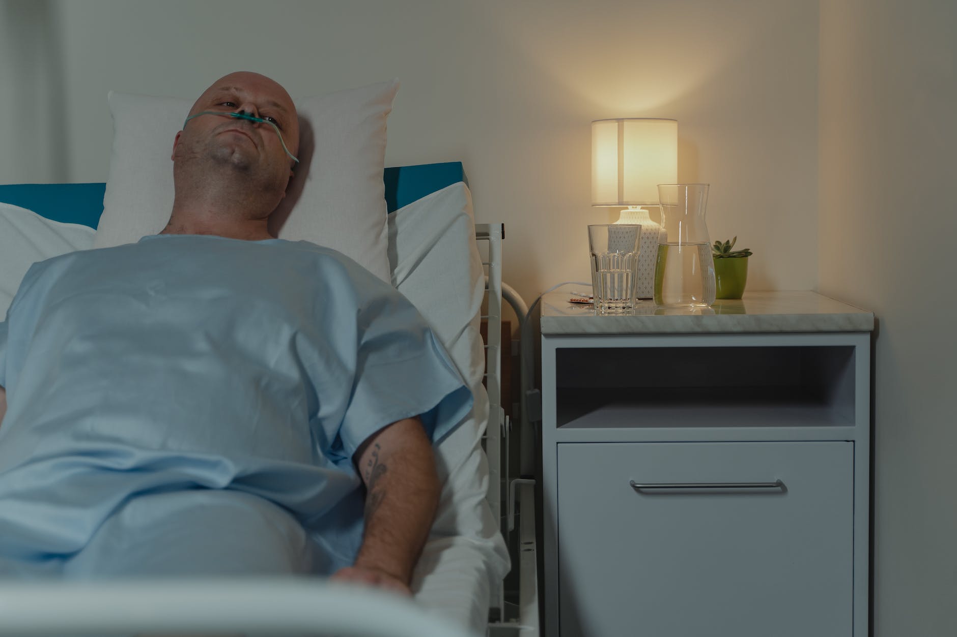 male patient in hospital bed