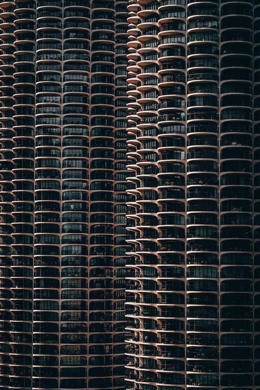 High rise building with repetitive glass window pattern.