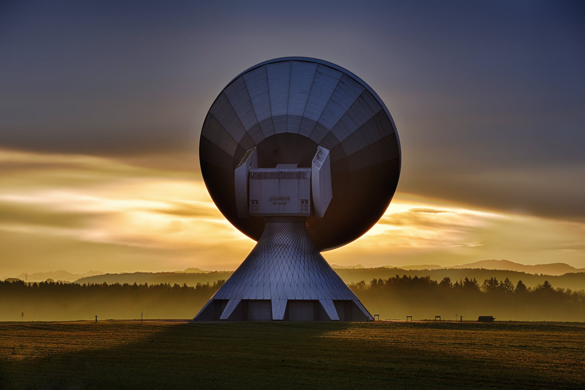 white satellite dish and sunset