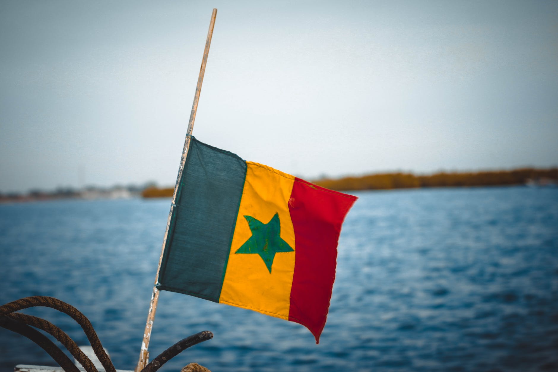 Senegal flag and sea in the background