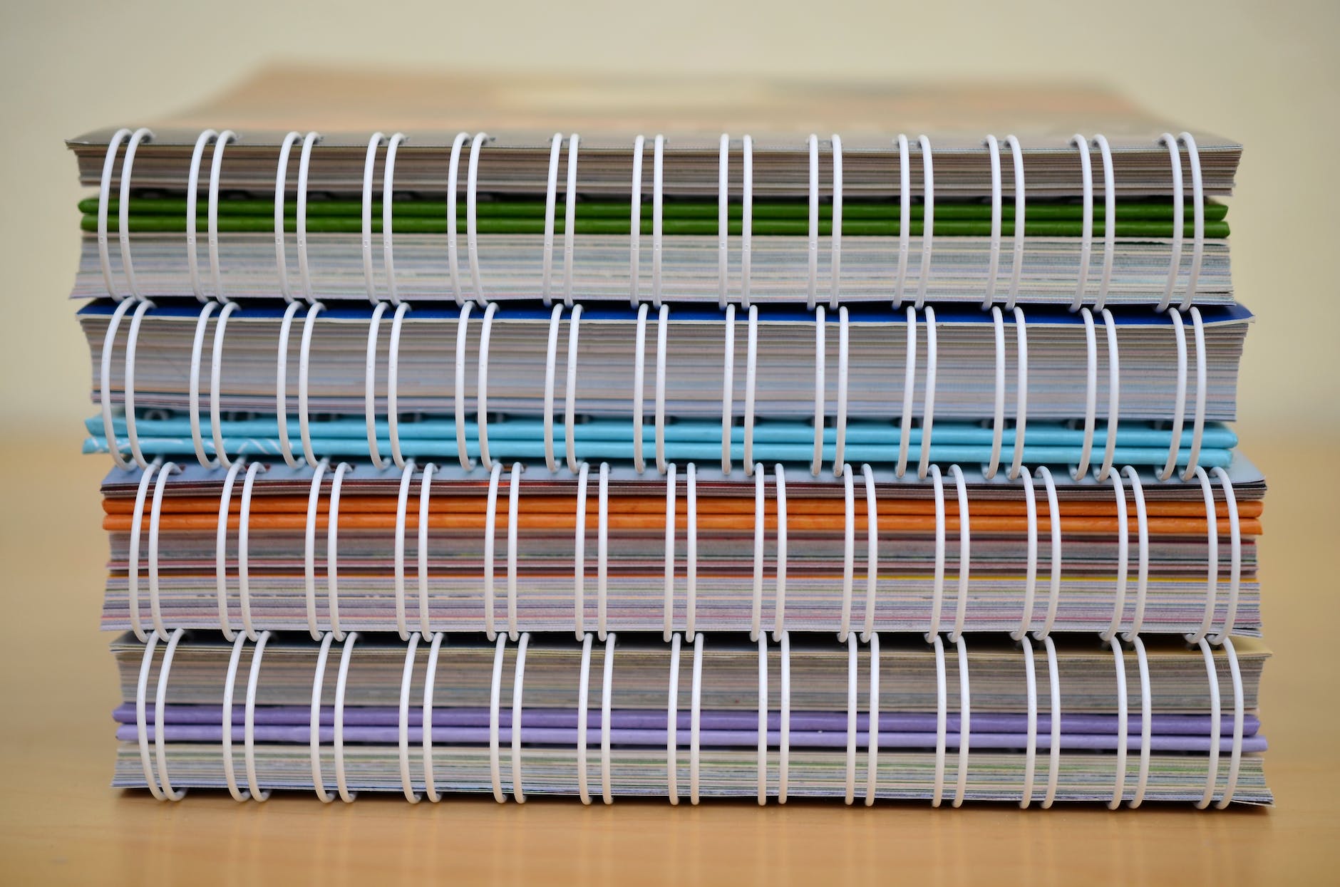 pile of notebooks with springs