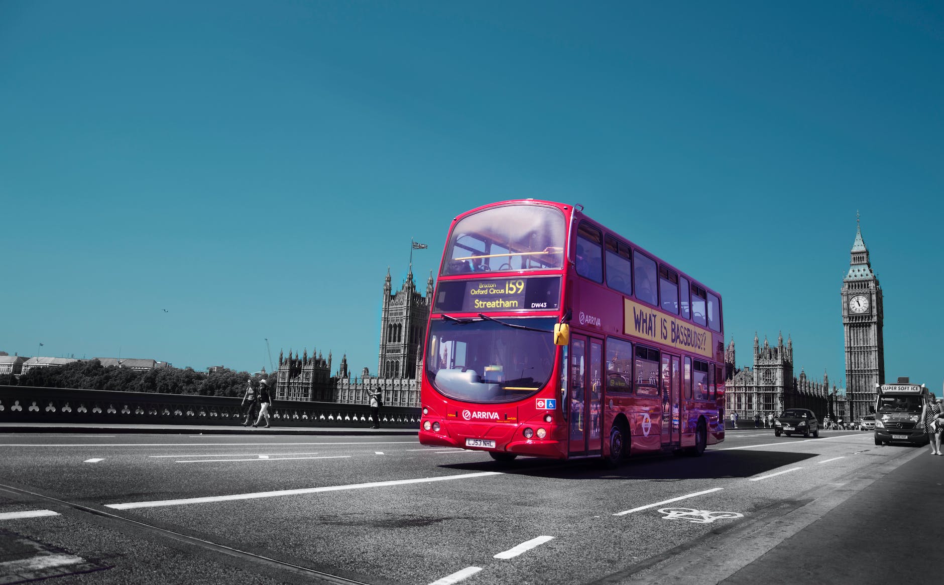 red double deck bus on road