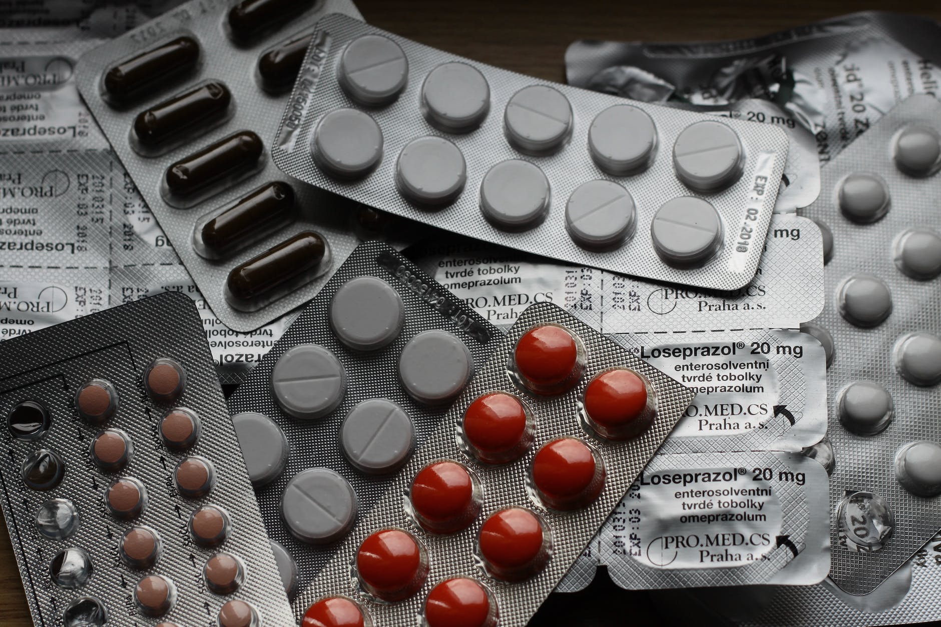 20 mg label and several different types of pills in their packaging