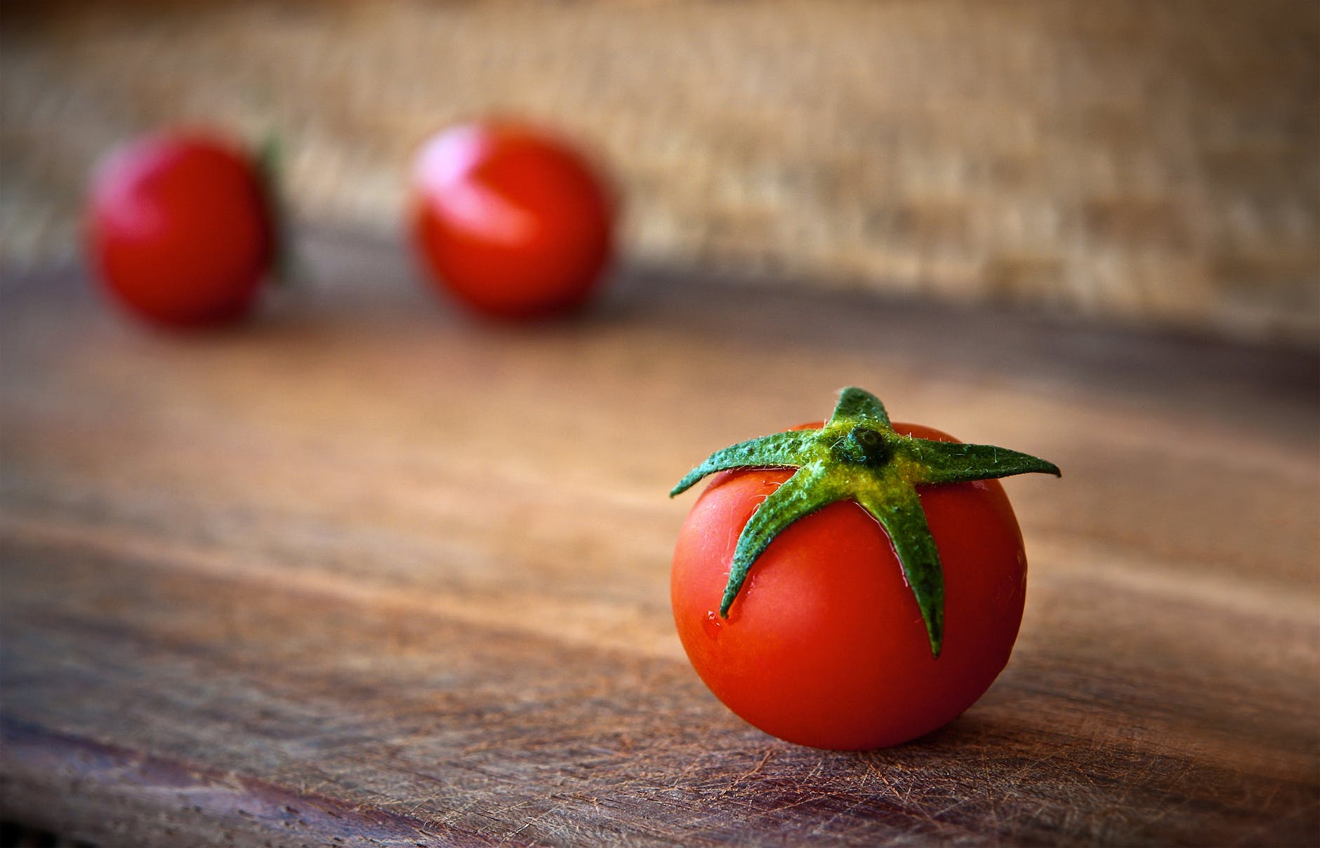 close-up of tomatoes on wooden table