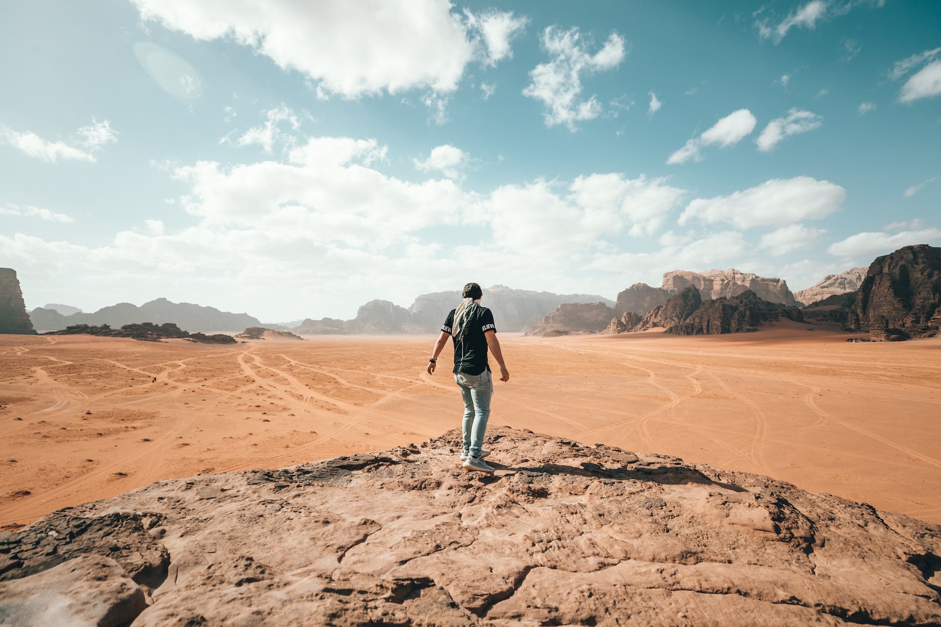 traveler exploring rocky and arid terrain