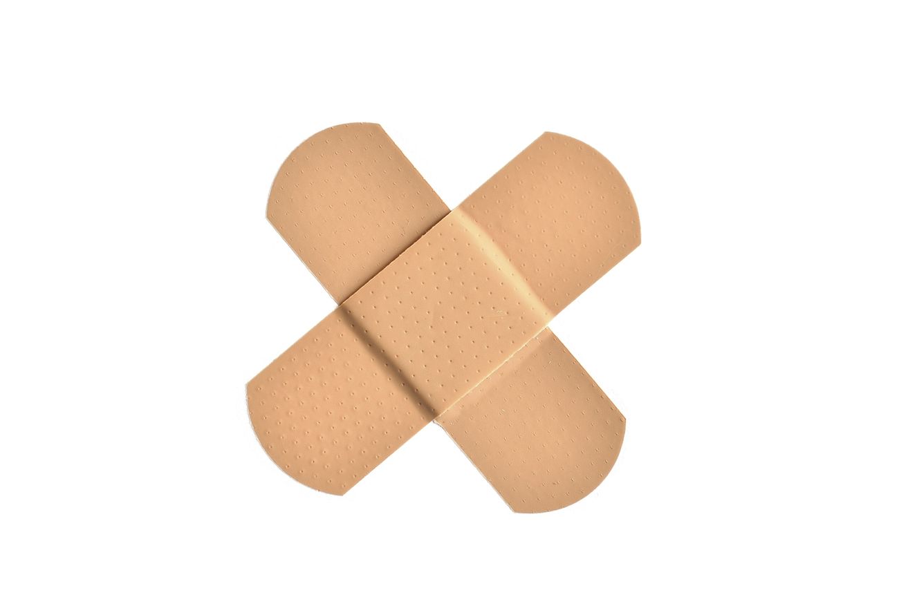 two bandages forming an X