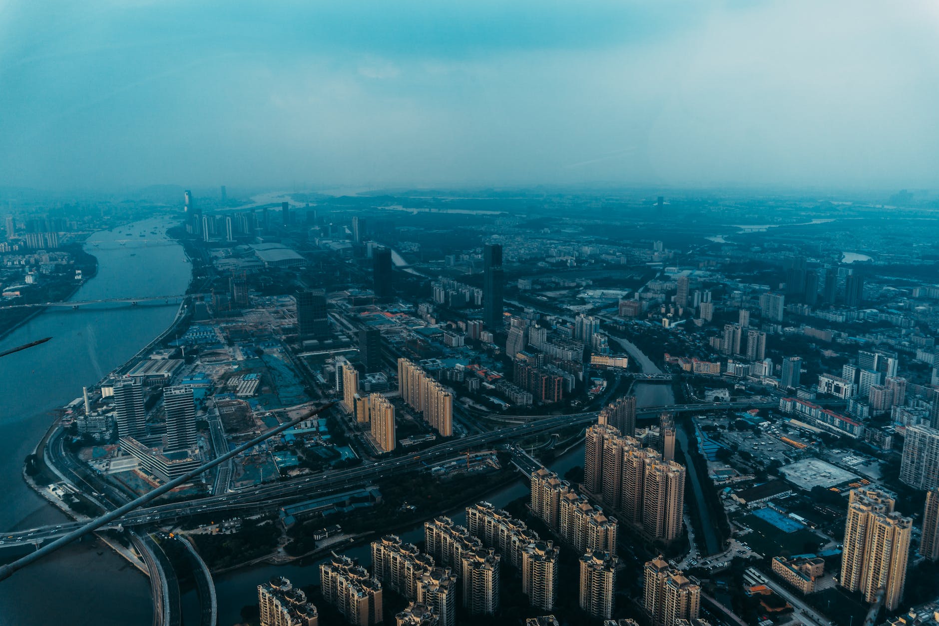 aerial view of city with towers and roads