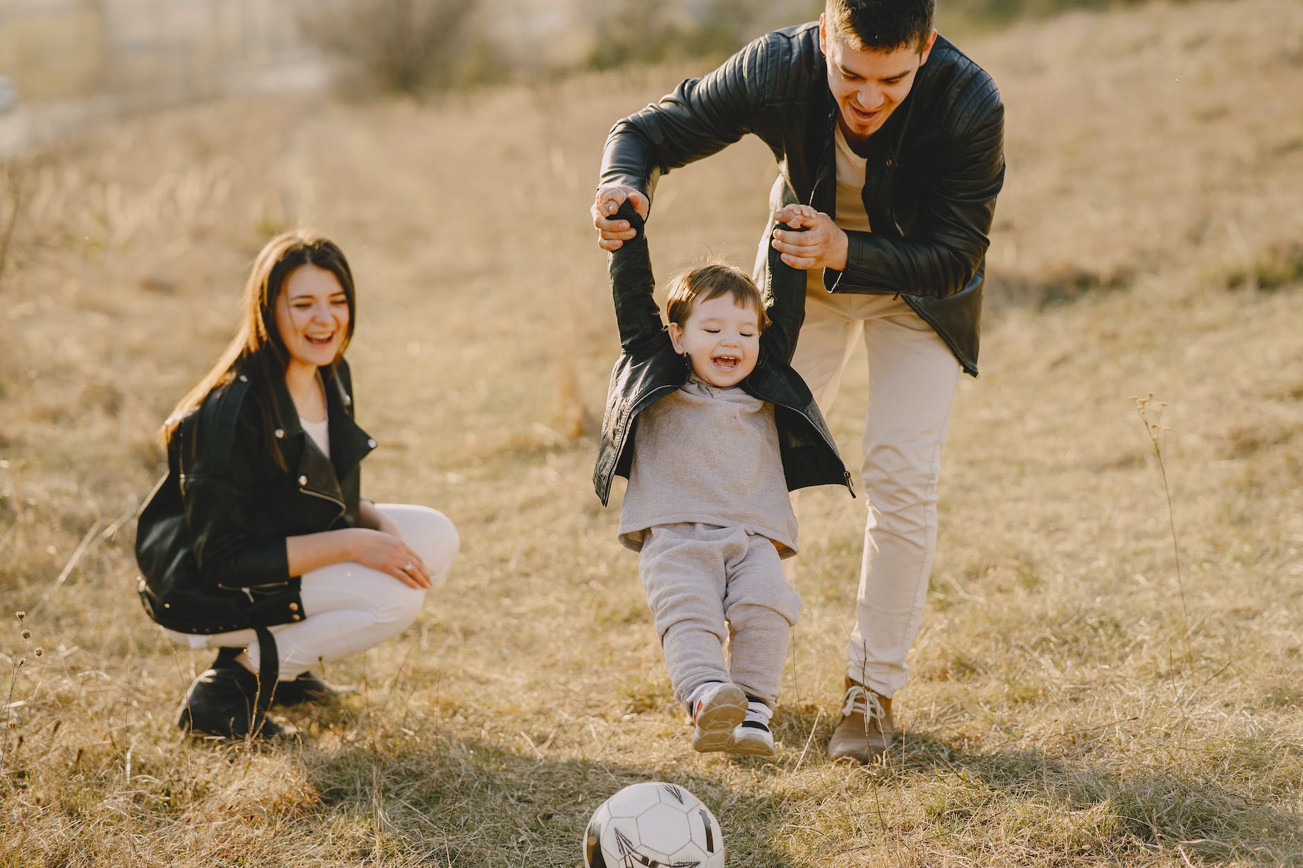 family having fun with soccer ball