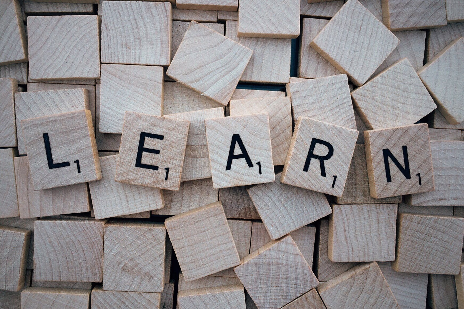 Scrabble letters forming word LEARN