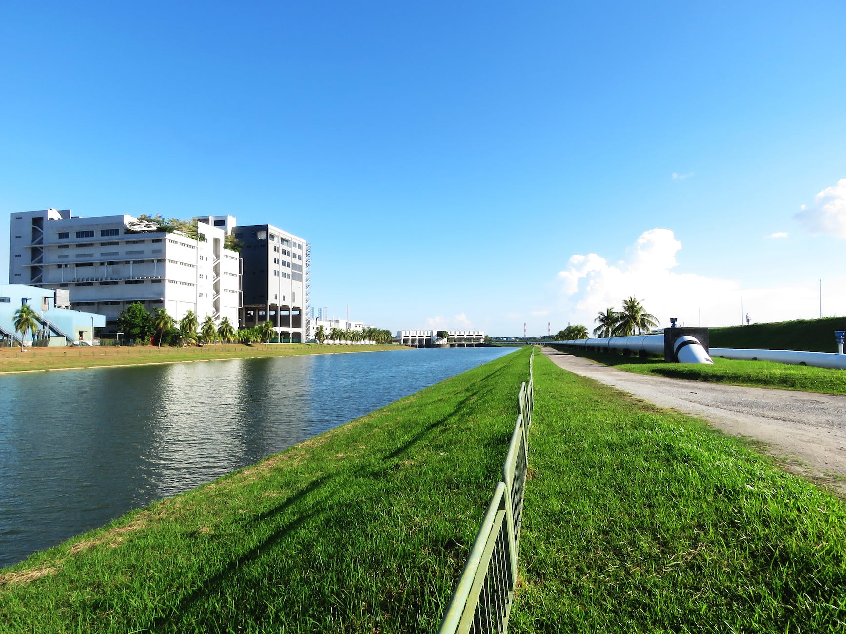 pipe in field next to river and skyline