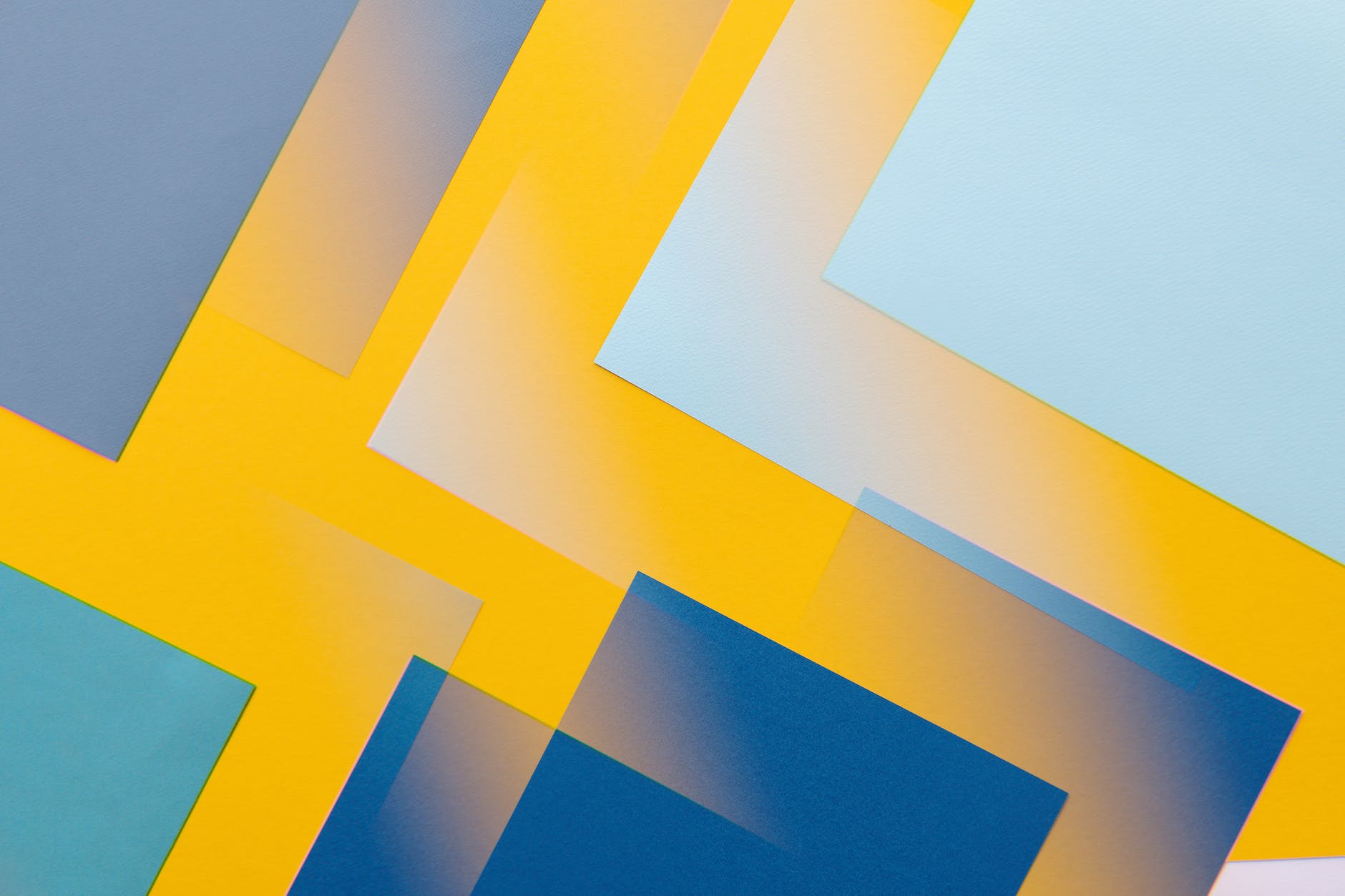 multiple overlay of patterns of a colorful blue, yellow, cyan design