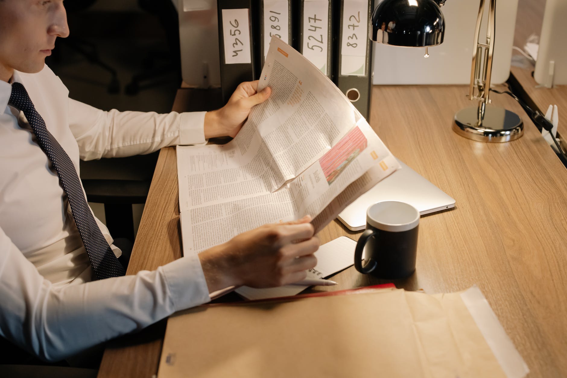 person holding paper with text